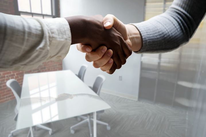 Business contract document review and signing in boardroom